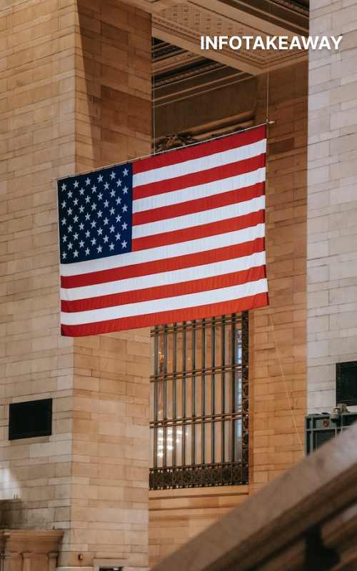 US flag hanging on a horizontal pole