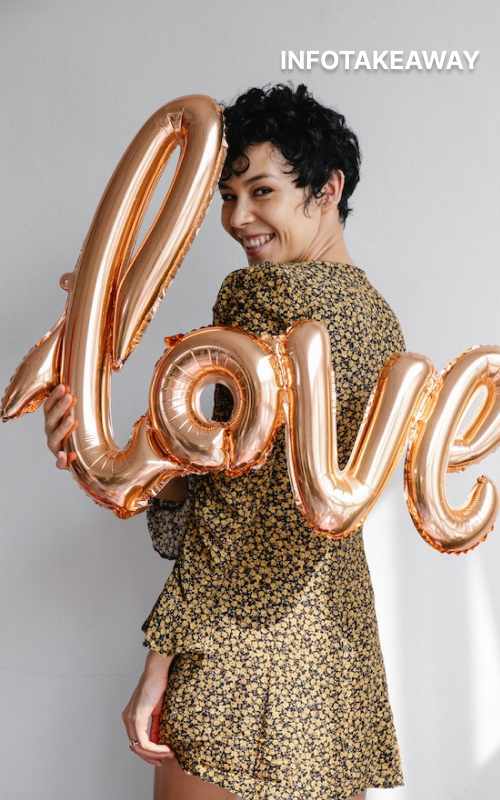 Woman holding balloons with love letters